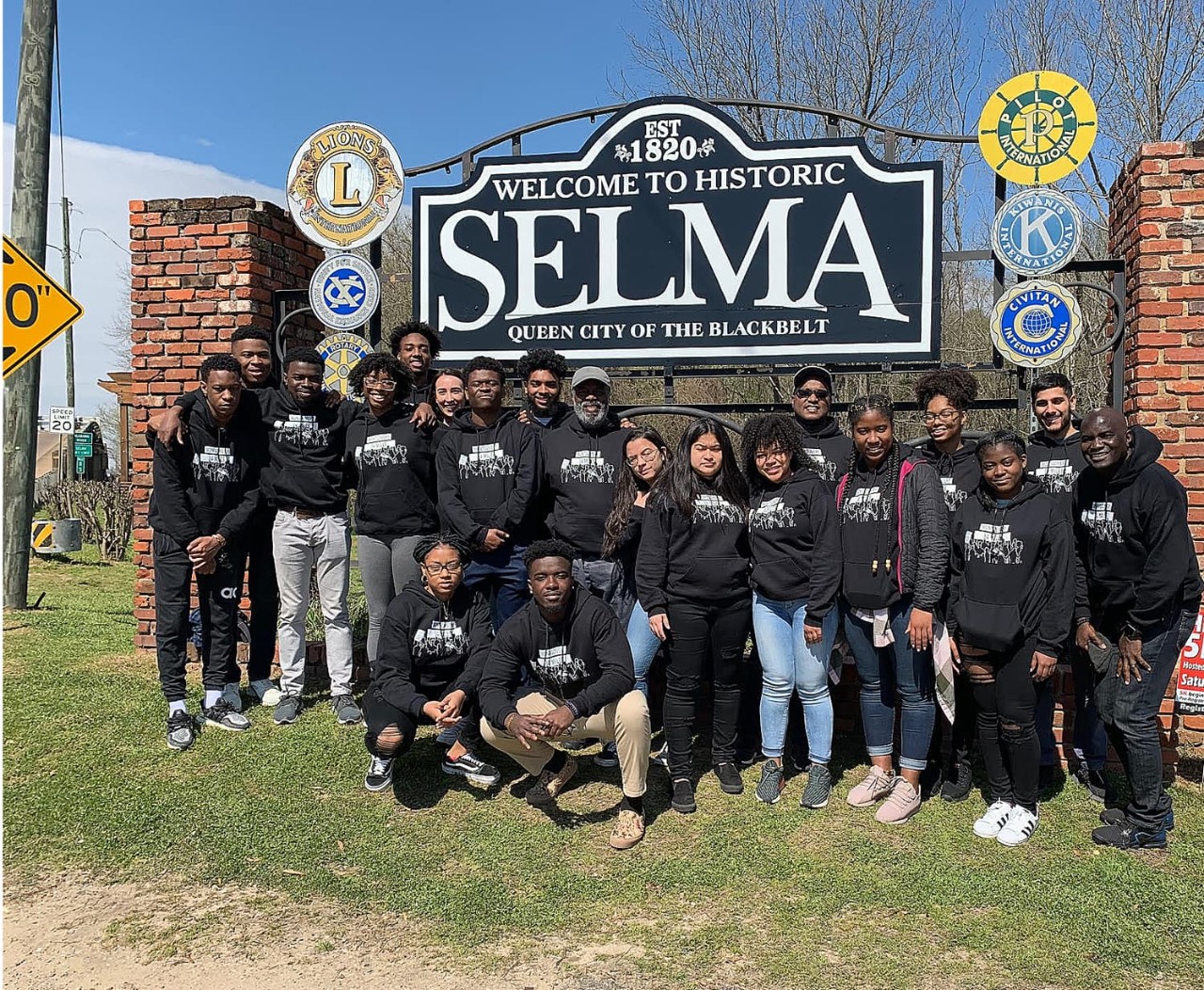 A group photo of students in front of the Selma, Alabama sign