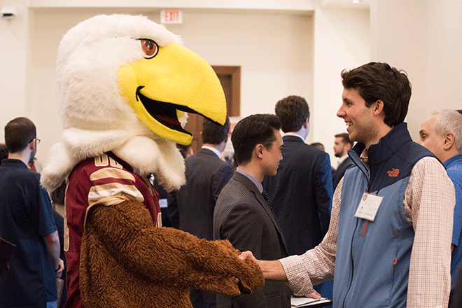 Employer and student talking at career fair