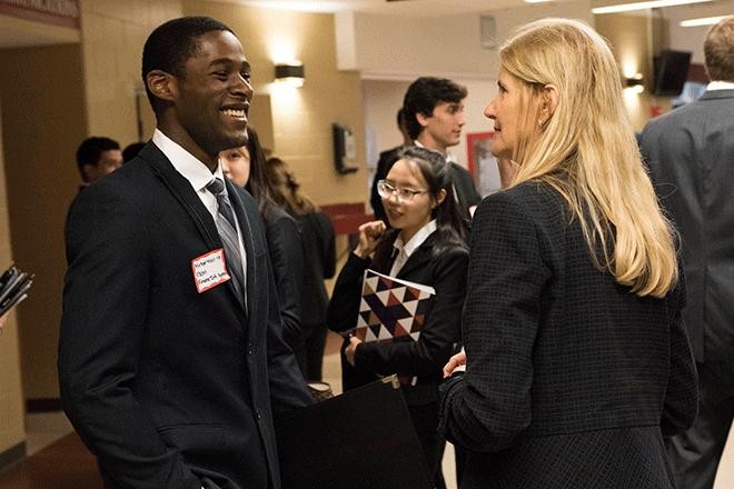 Employer and student talking at career fair