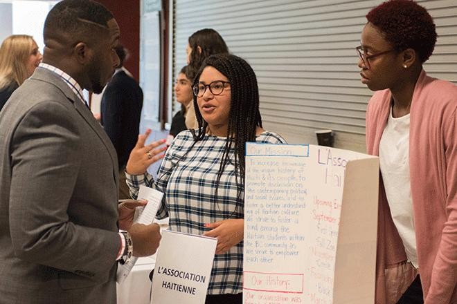 Employer and student talking at career fair