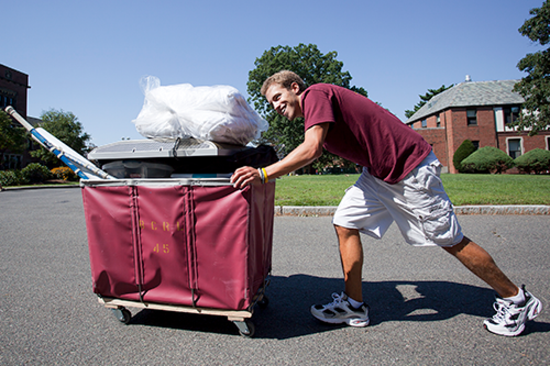 student pushing a cart