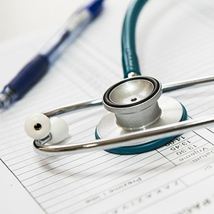 Photo of a stethoscope resting on a patient chart