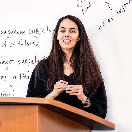 person in front of a whiteboard