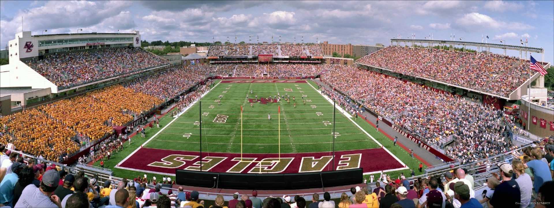 BC students cheering at a football game in Alumni stadium