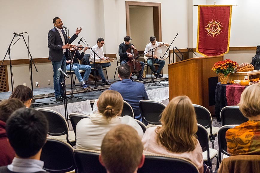 Boston-based Noor Ensemble performing on a stage at the MultiFaith Thanksgiving celebration