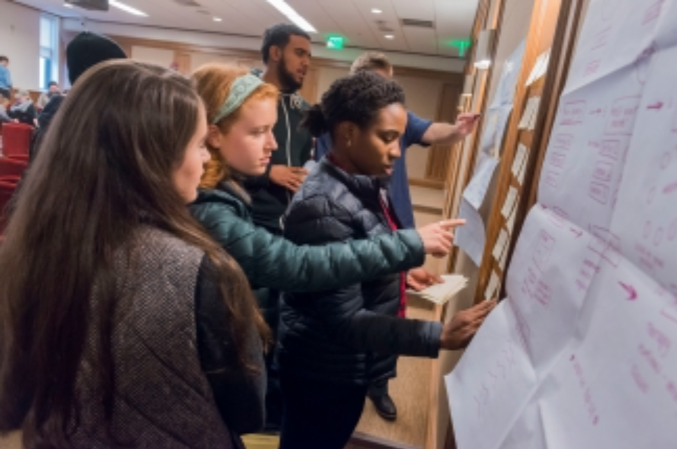 students in front of a whiteboard