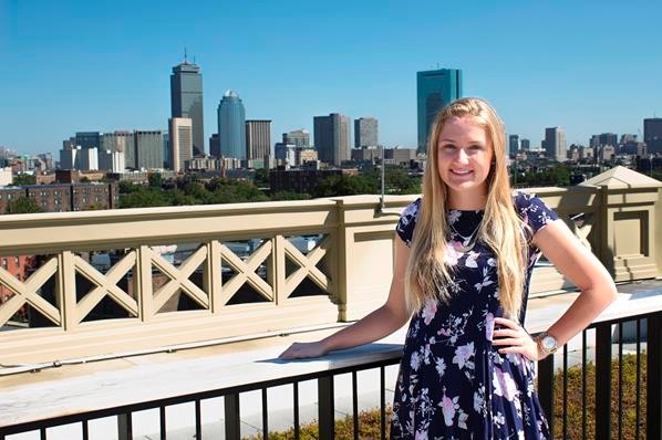 Camryn Hicks '18 (center) in front of the Boston skyline