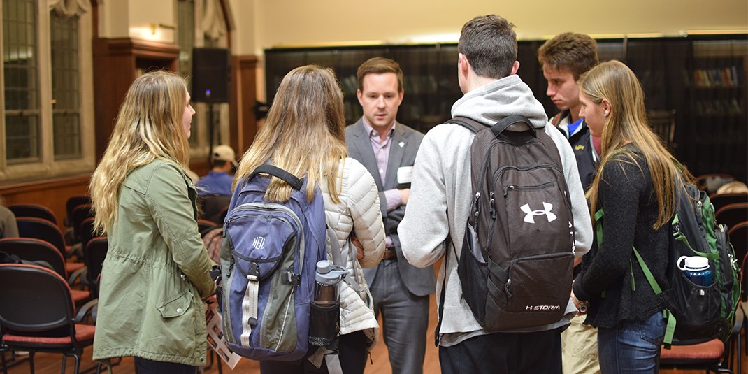 Students meet with panelist at Careers in Social Impact Event