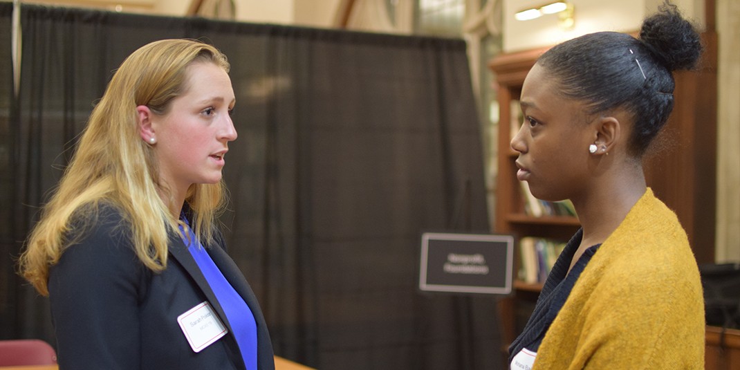 A student meets with a panelist at the Careers for Social Impact event