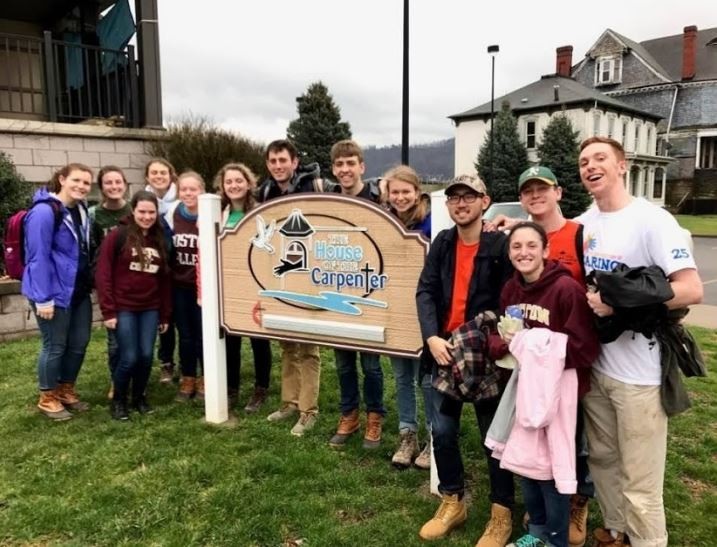 Tom Whittam, Carroll School ’17 (far right), at The House of the Carpenter, a faith-based service organization headquartered in Wheeling, West Virginia.
