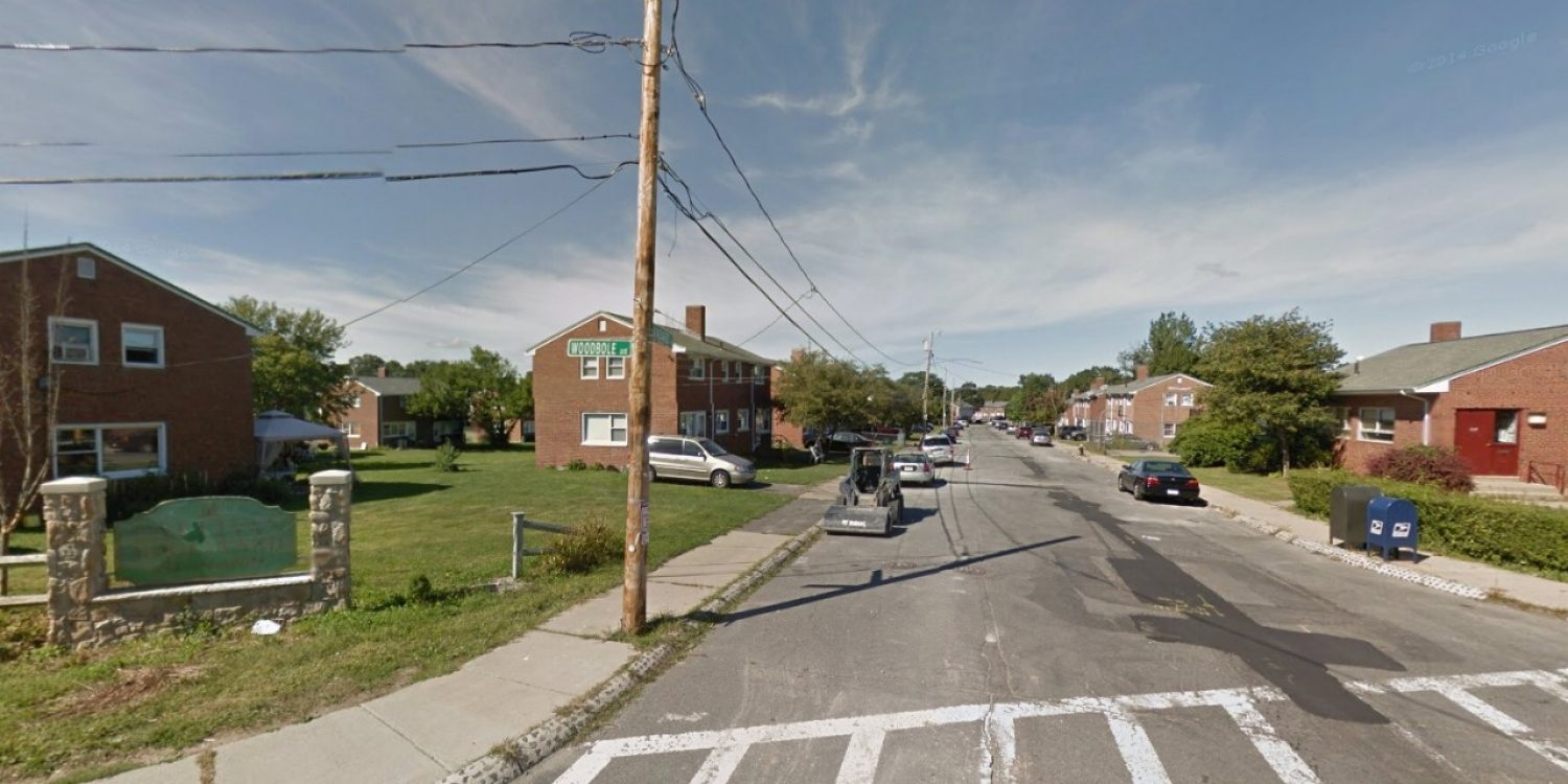 Google streetview screenshot of a neighborhood with small brick houses on an old road