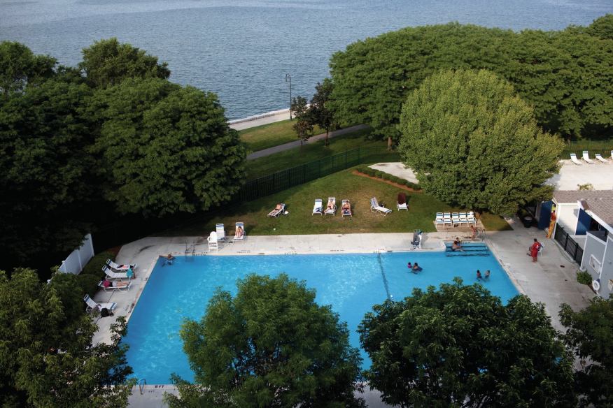 Aerial photo of children playing in the Harbor Point on the Bay outdoor pool overlooking the Boston Harbor