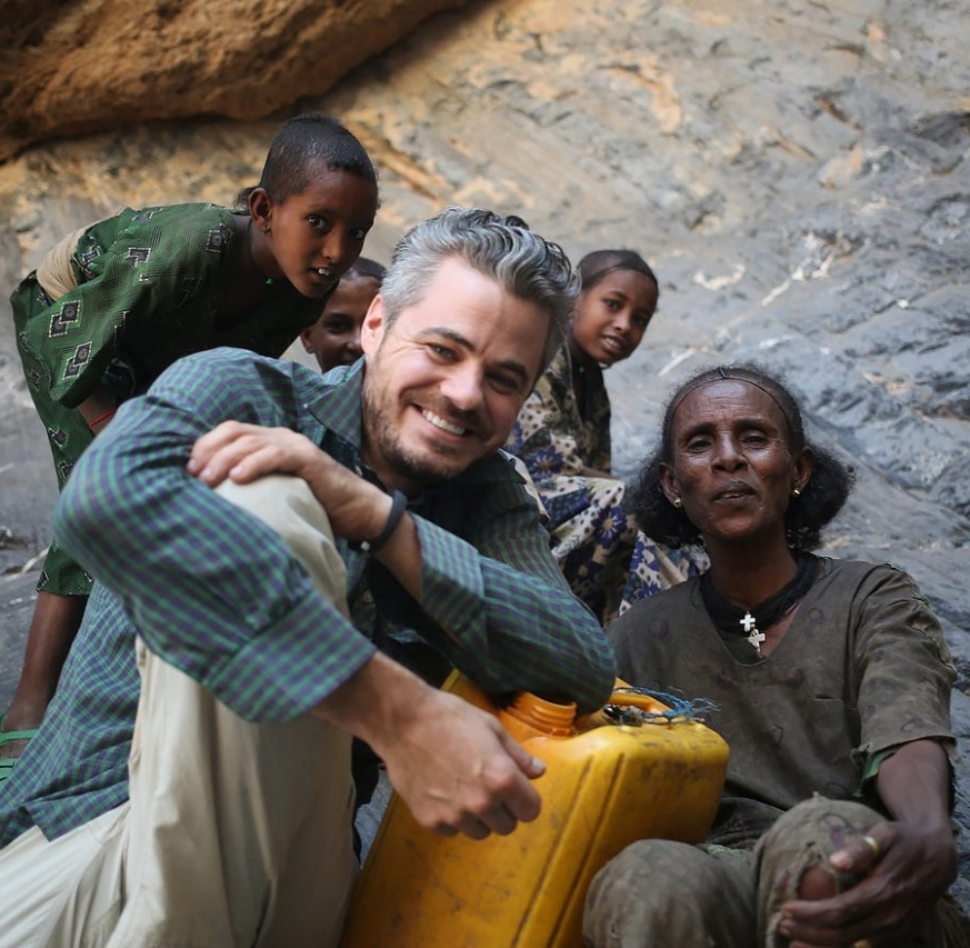 Scott Harrison with villagers in Africa