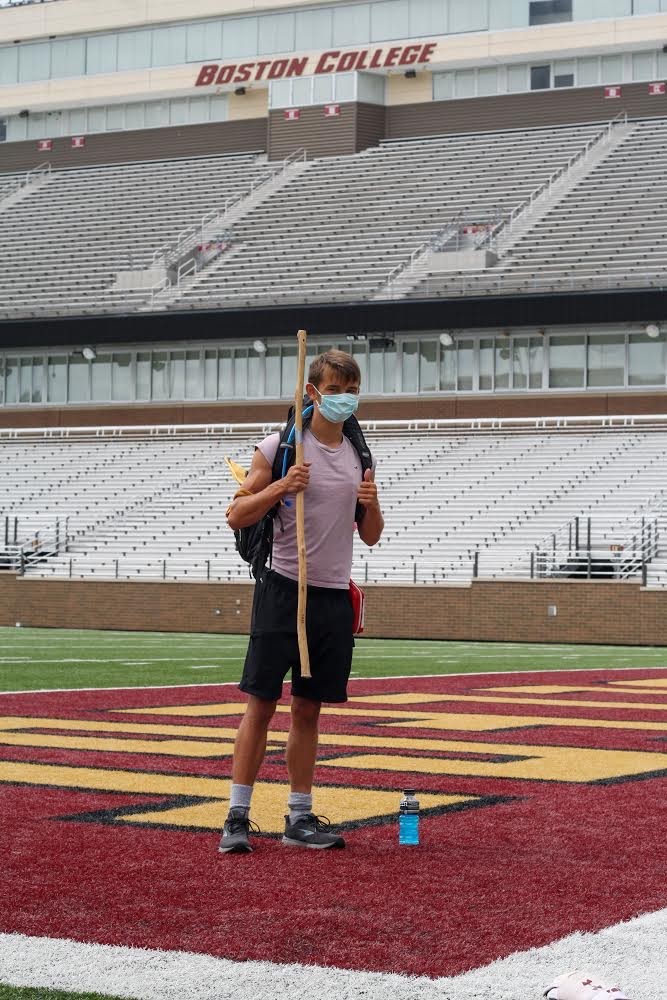 Gordon Wayne stands on the football field in Alumni Stadium