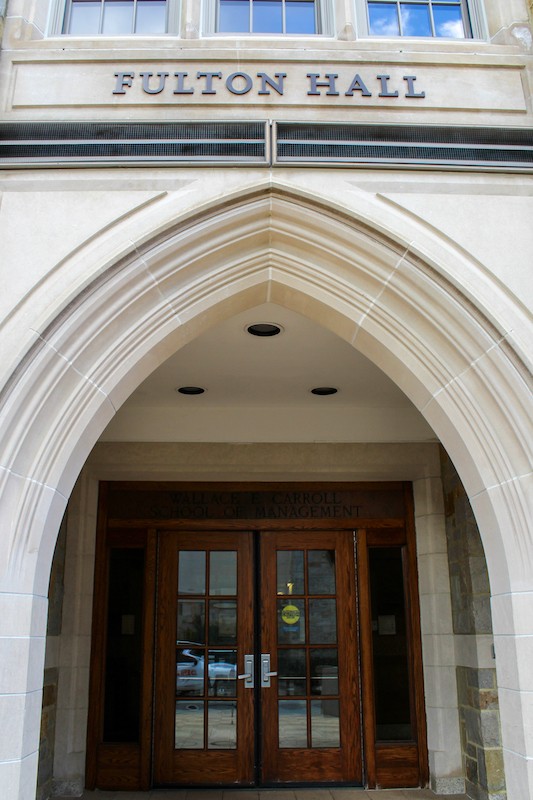 Entrance to Fulton Hall with building name above arch