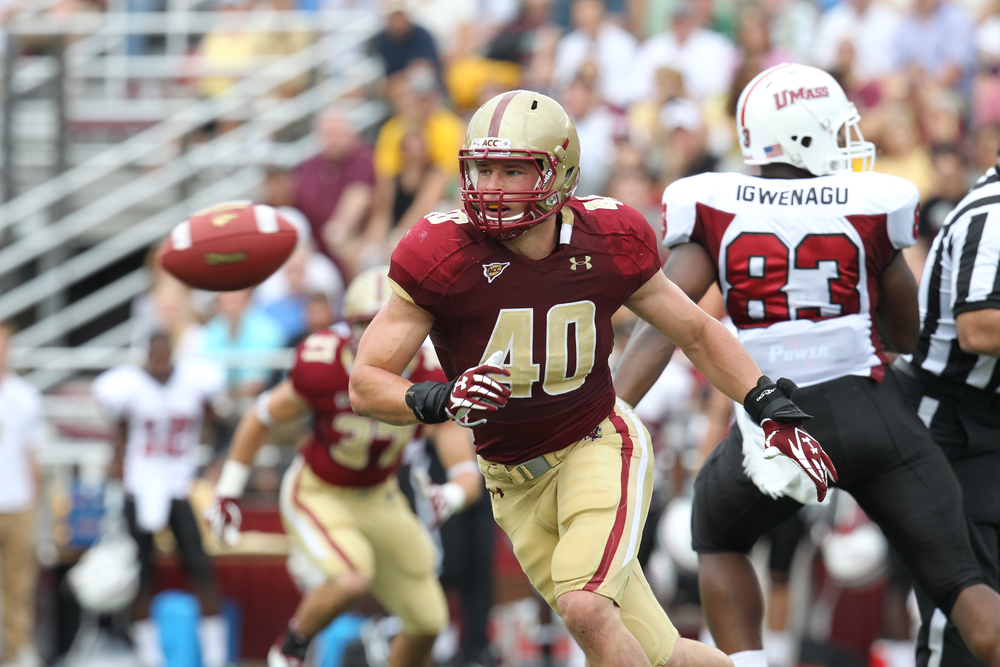 Luke Kuechly '15 playing football at BC