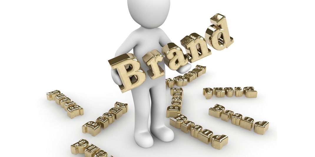 Photo of computer generated figure holding bubble letters spelling out "Brand"