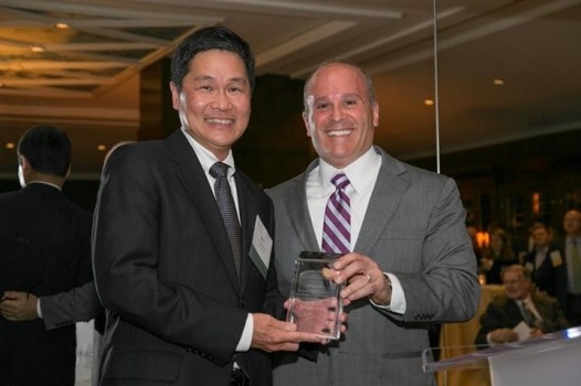 Billy Soo and Daniel Fasciano holding award plaque