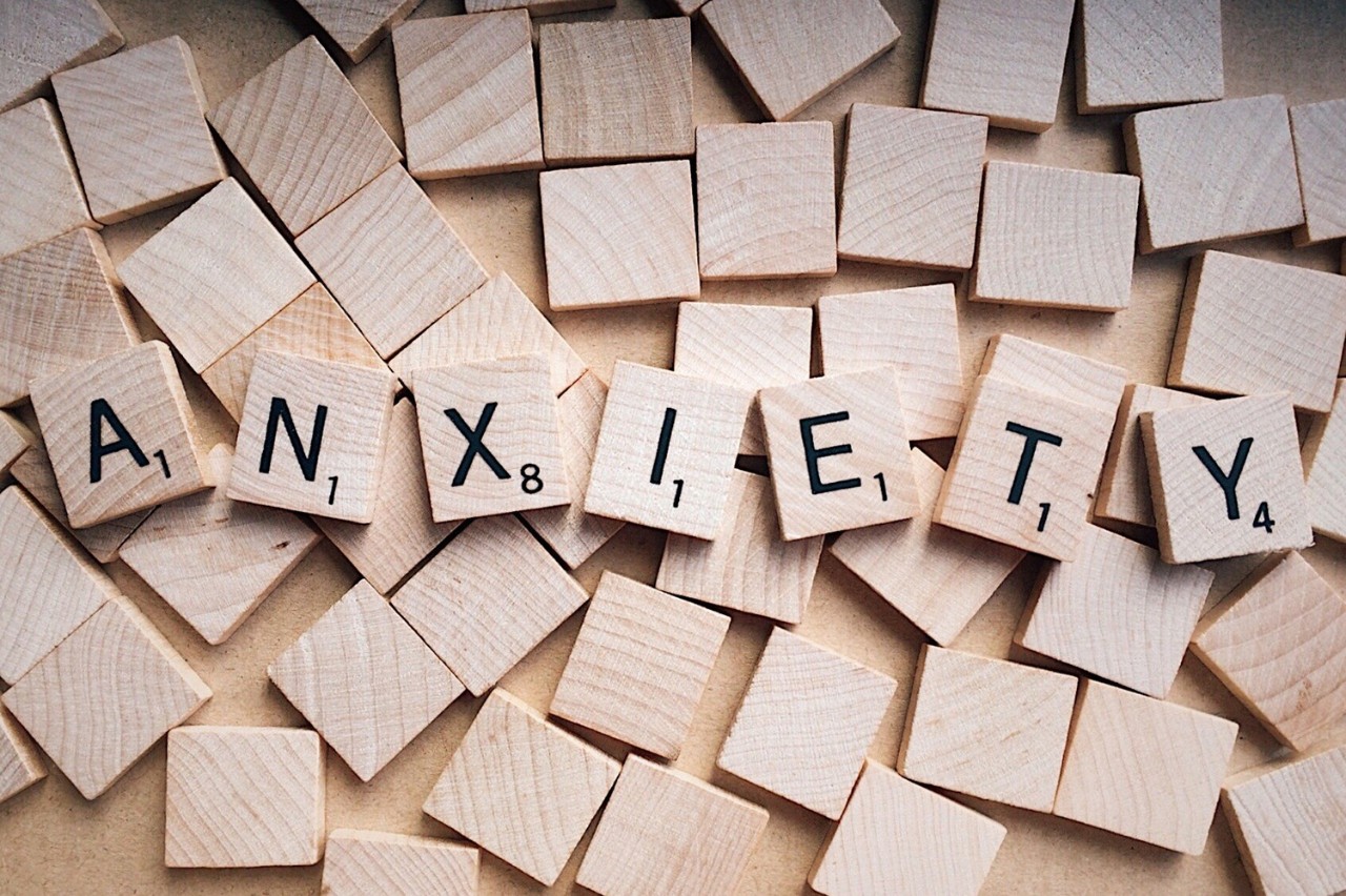 Scrabble tiles spelling out anxiety