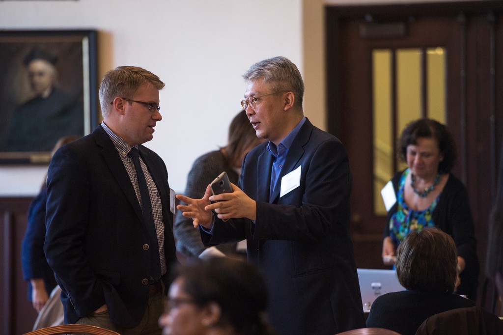 Two people speaking at a business roundtable event