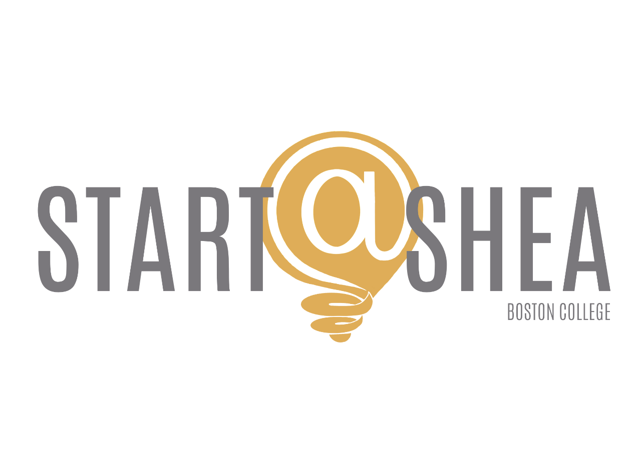 The Start@Shea logo, which features gray text in a sans serif font reading START SHEA BOSTON COLLEGE. In between the words 'start' and 'Shea' is a gold lightbulb shape, where the buld filament creates the shape of an @ symbol.