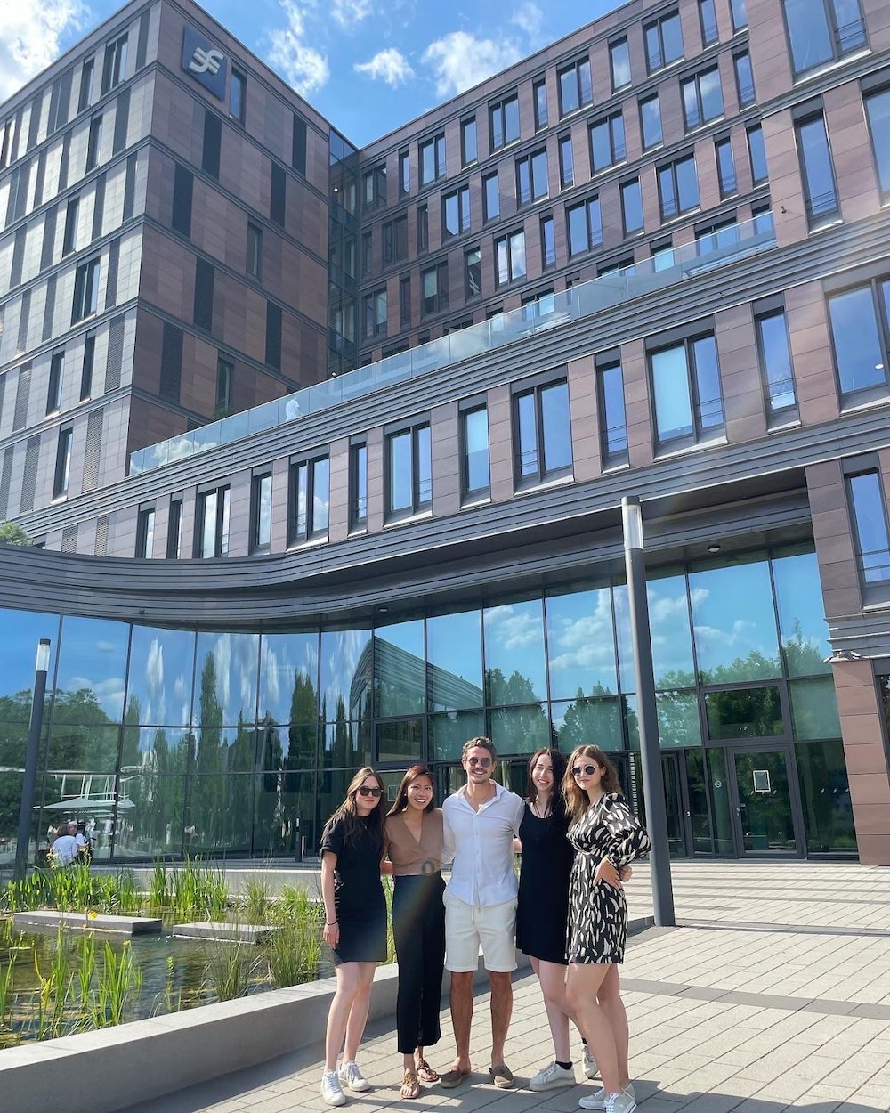 students in front of an office building