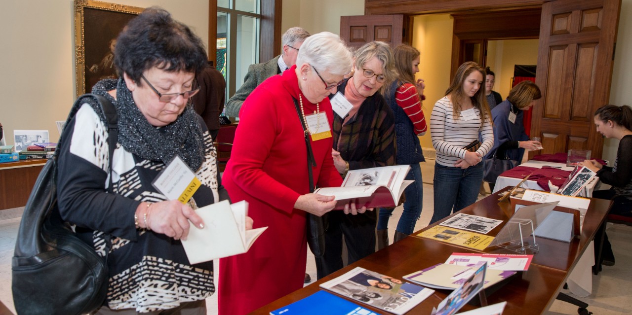 Marie McCarthy '65, Muffie (Tilley) Martin '66, Margaret Mone '64, and Jessica Kwasnik '17 view the exhibition of nursing objects