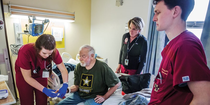 Anne O'Malley '16 with patient Peter Kyer, Clinical Associate Professor Stacey Barone, and preceptor Sean Chenery