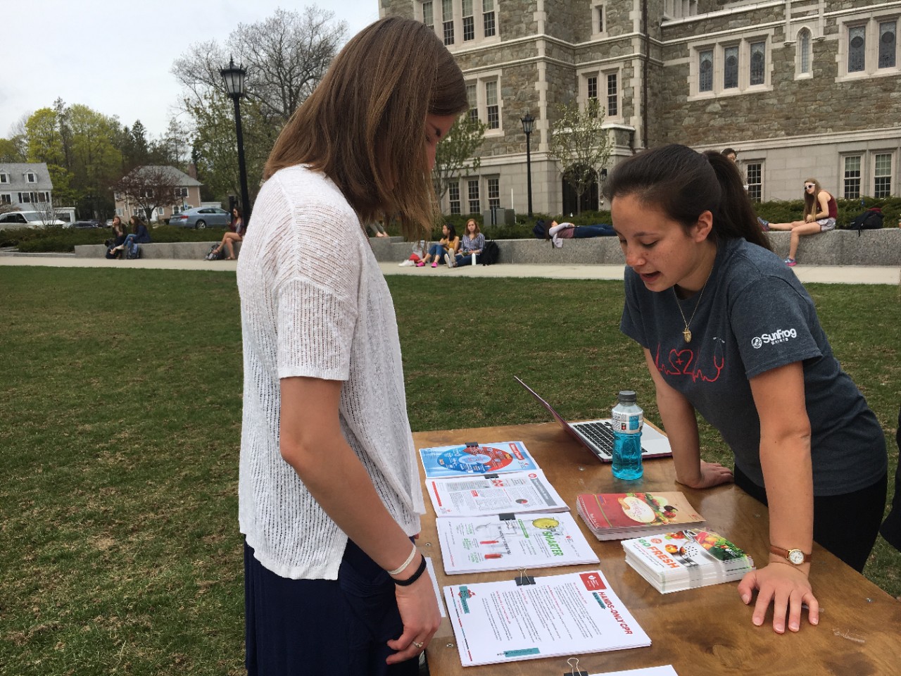 Conti teaches a student about Hands-Only CPR