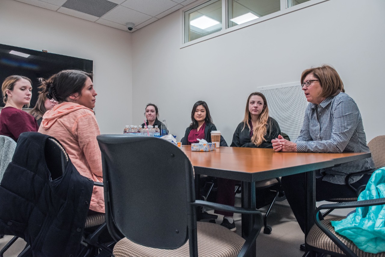 Cullinan (right) debriefs with students