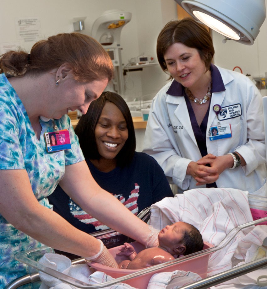 Brigham and Women’s Hospital staff nurse Jean Reilly, new mother Carla Wilson, and Assistant Professor and Haley Nurse Scientist Katherine Gregory with Wilson’s daughter Alana Nelligan. Photograph: Lee Pellegrini
