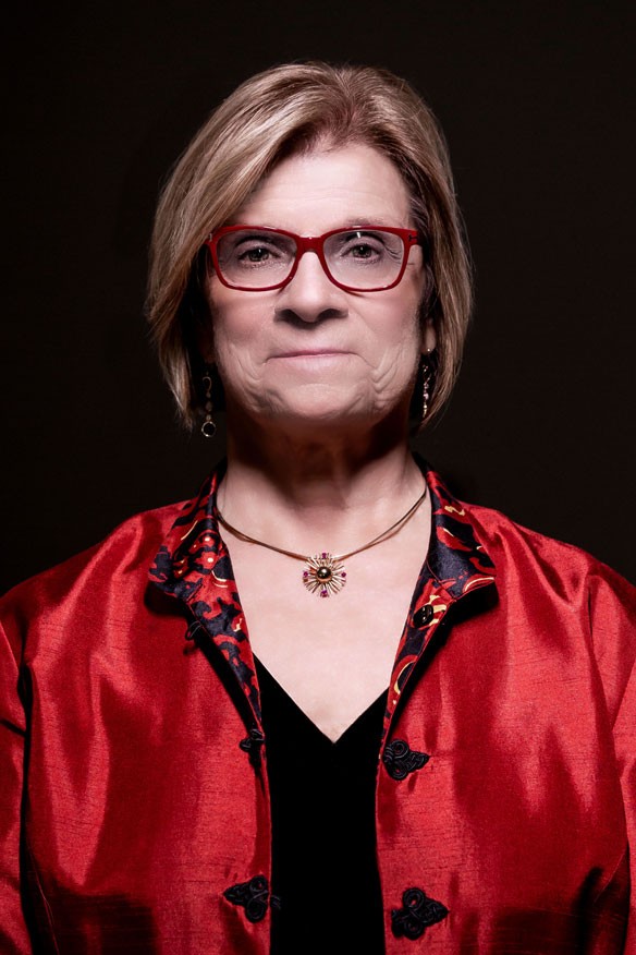 Dean Susan Gennaro in red jacket and black dress