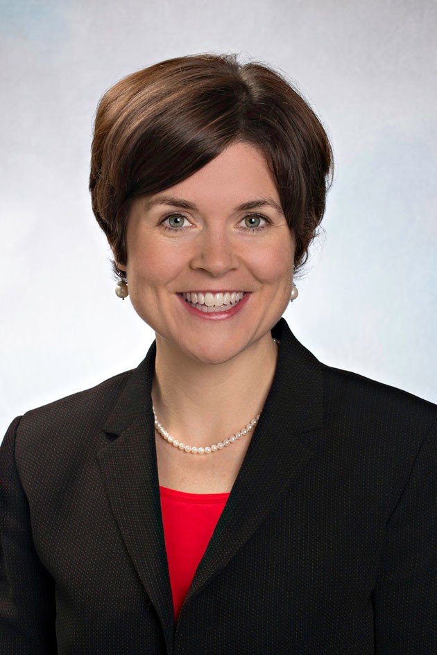 Incoming Dean Katherine Gregory in black jacket and red blouse