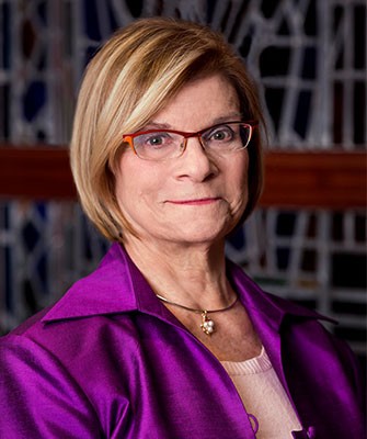 CSON Dean Susan Gennaro in a purple jacket, looking at the camera