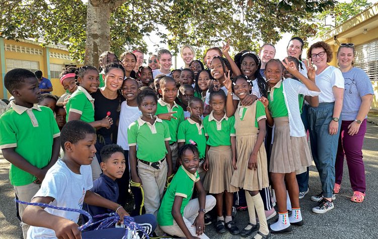 Students and faculty take selfie with students in the Dominican Republic