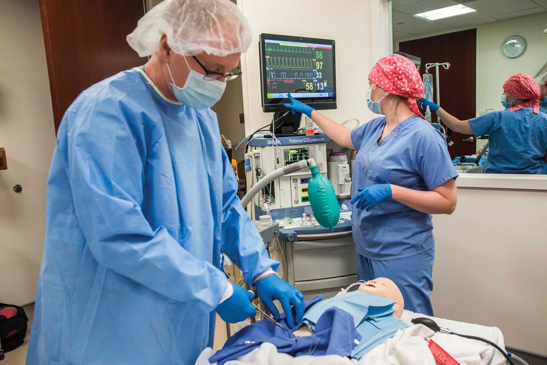 Nurse Anesthesia Clinical Instructor Allan Thomas and Chelsea Hough, M.S. ’16, in one of four new simulation labs.