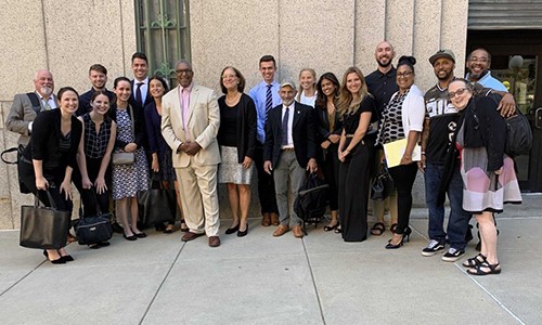 Milton Jones and team outside courthouse