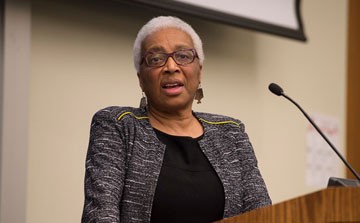 Hines at the podium at the Pro Bono panel