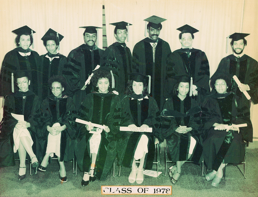 13 Black students posed together for a graduation photo with a caption reading Class of 1978