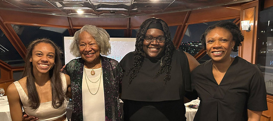 Professor Ruth-Arlene Howe ‘74 and Rosaline Valcimond ’05 with scholarship recipients Haluwa Doherty ‘24 (left) and Reginé Cooper ‘24 (center right).