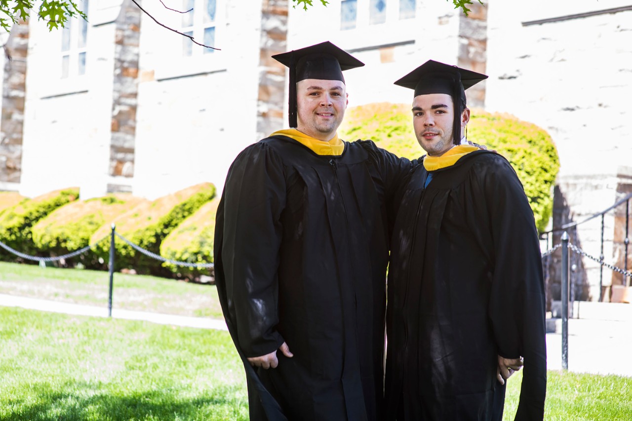Photo of Two students in gowns