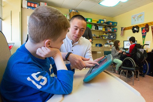 teacher working with child