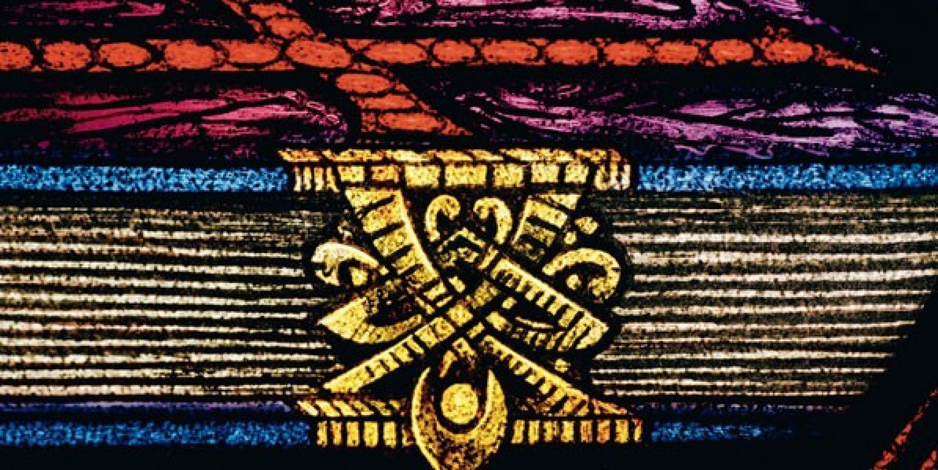 Stained glass image of book with cross on top