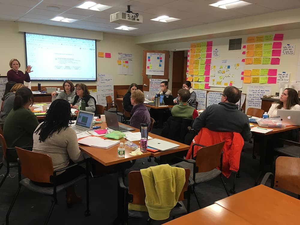 Teachers meeting in a classroom
