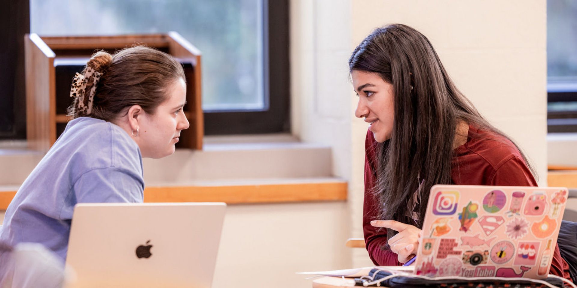 Two students in Faythe Beauchemin's Teaching Reading course