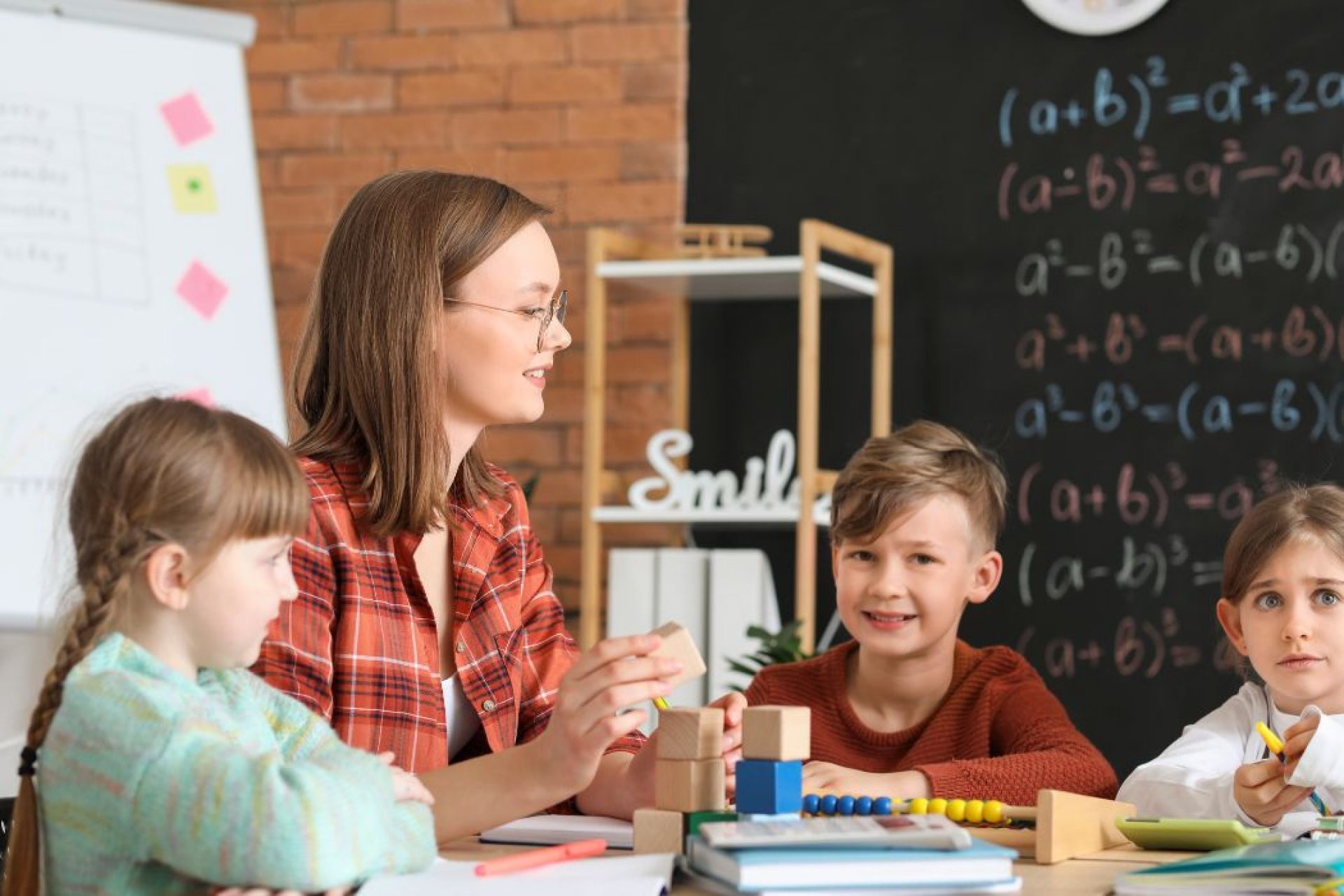 kids learning math with teacher