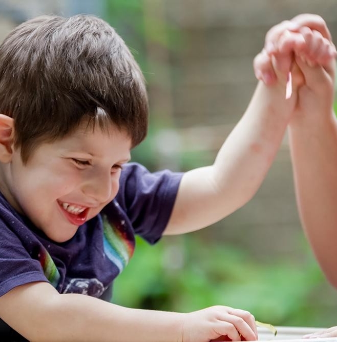 A boy giving a high five