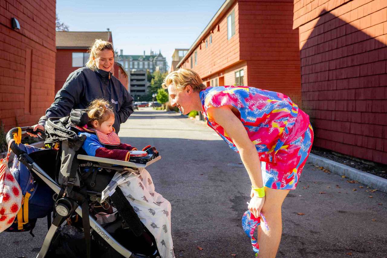 A student in a wheelchair wearing a Halloween mask