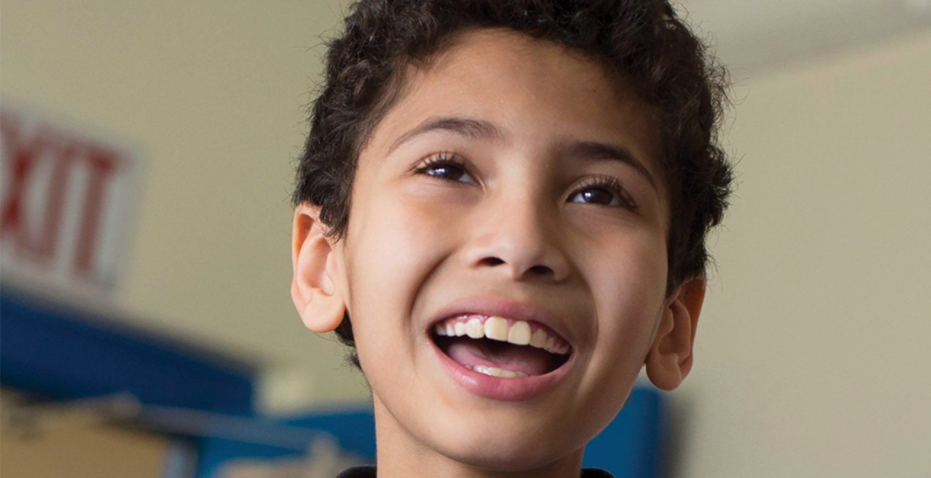 school-aged child speaking in class