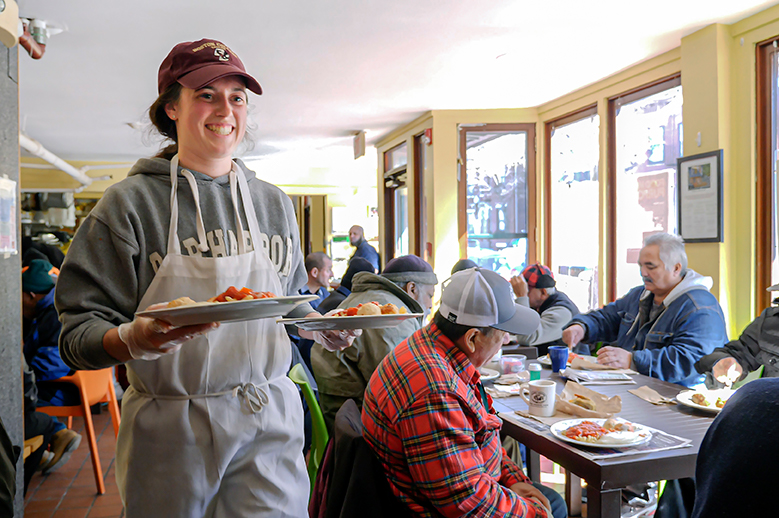Photo of student volunteering at Haley House soup kitchen